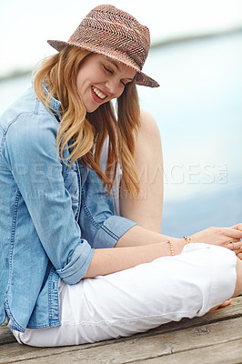 Buy stock photo Woman, lake and smile with view, thinking and relax for holiday, vacation or happy on travel journey. Girl, tourist and dock with calm in nature, environment or sightseeing by water in Denmark