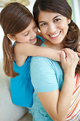 Buy stock photo Smile, mother and hug child in family home for love, care and bonding together in living room. Happy girl, mom and embrace kid for support, connection and trust single parent with foster daughter