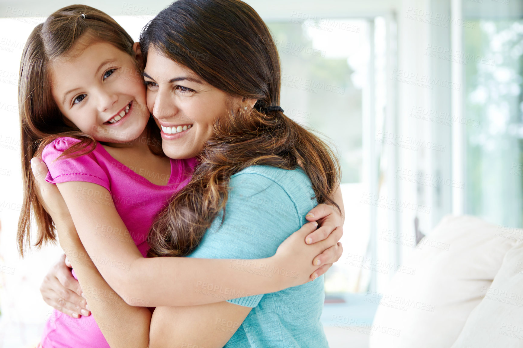 Buy stock photo Smile, mom and embrace child in family home for love, care and bonding together in living room. Happy girl, mother and hug kid for support, connection and trust single parent with custody of daughter