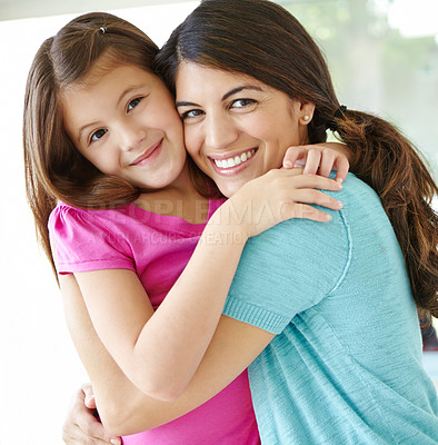 Buy stock photo Happy mom, portrait and hug kid in family home for love, care or bonding together to relax. Face, mother and embrace girl for support, connection or safety of daughter with single parent in Germany