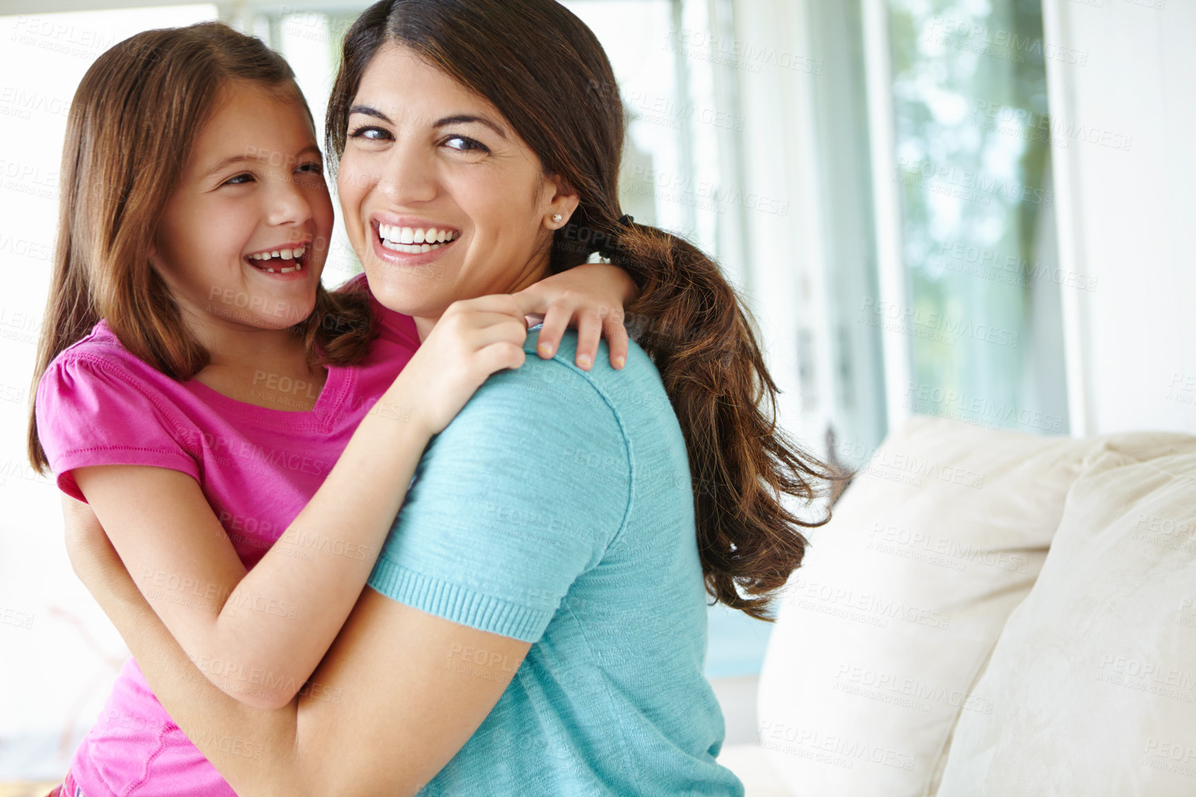 Buy stock photo Funny, mom and embrace kid in home for love, care and family laughing together in living room. Happy girl, mother and hug child for support, connection and trust single parent with adopted daughter