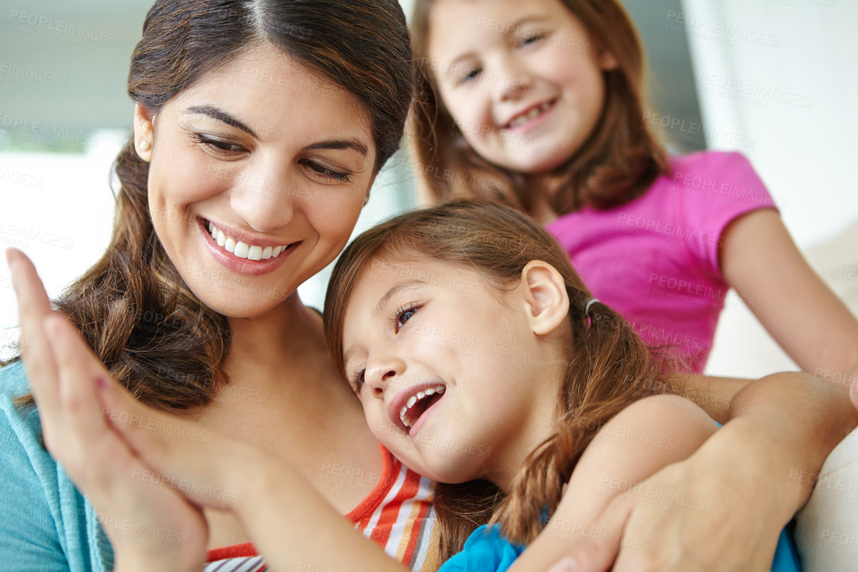 Buy stock photo Happy, children and smile with mother in home for development, support and bonding on weekend. Family, fun and girl kids with love by woman in house for care, connection and relaxing together