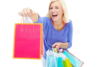 Buy stock photo Excited, shopping bag and studio portrait of woman with smile, fashion sale or discount offer at store. Giveaway, girl and happy customer giving gift of retail product at boutique on white background