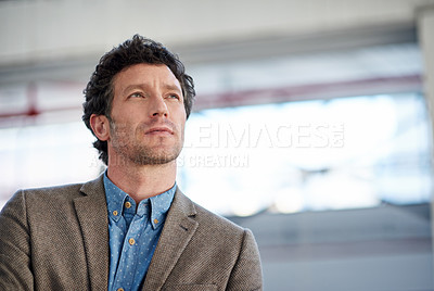 Buy stock photo Low angle shot of a mature man looking away meditatively, with copyspace