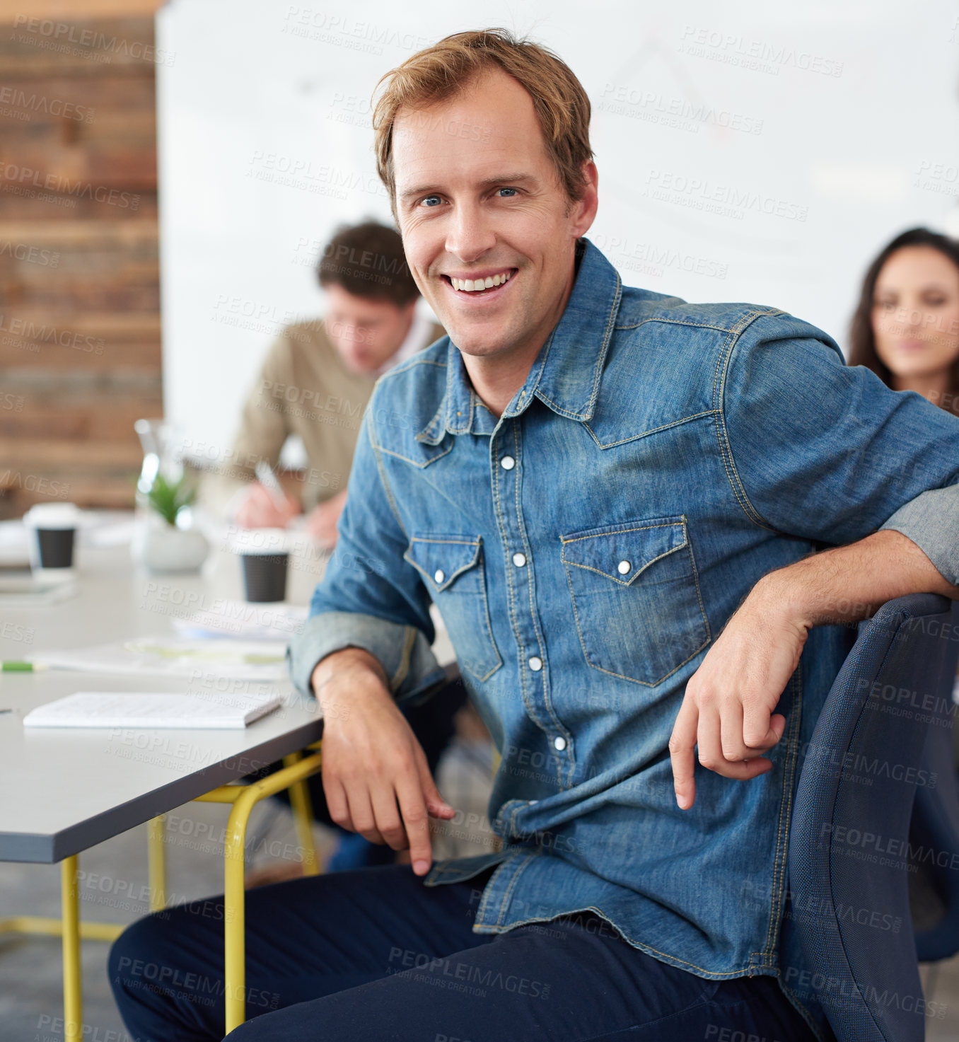 Buy stock photo Meeting, smile and portrait of businessman in office planning creative project with teamwork. Happy, discussion and male copywriter with group of colleagues working in collaboration in workplace.