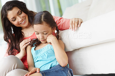 Buy stock photo Cute young mother and daughter relaxing together at home