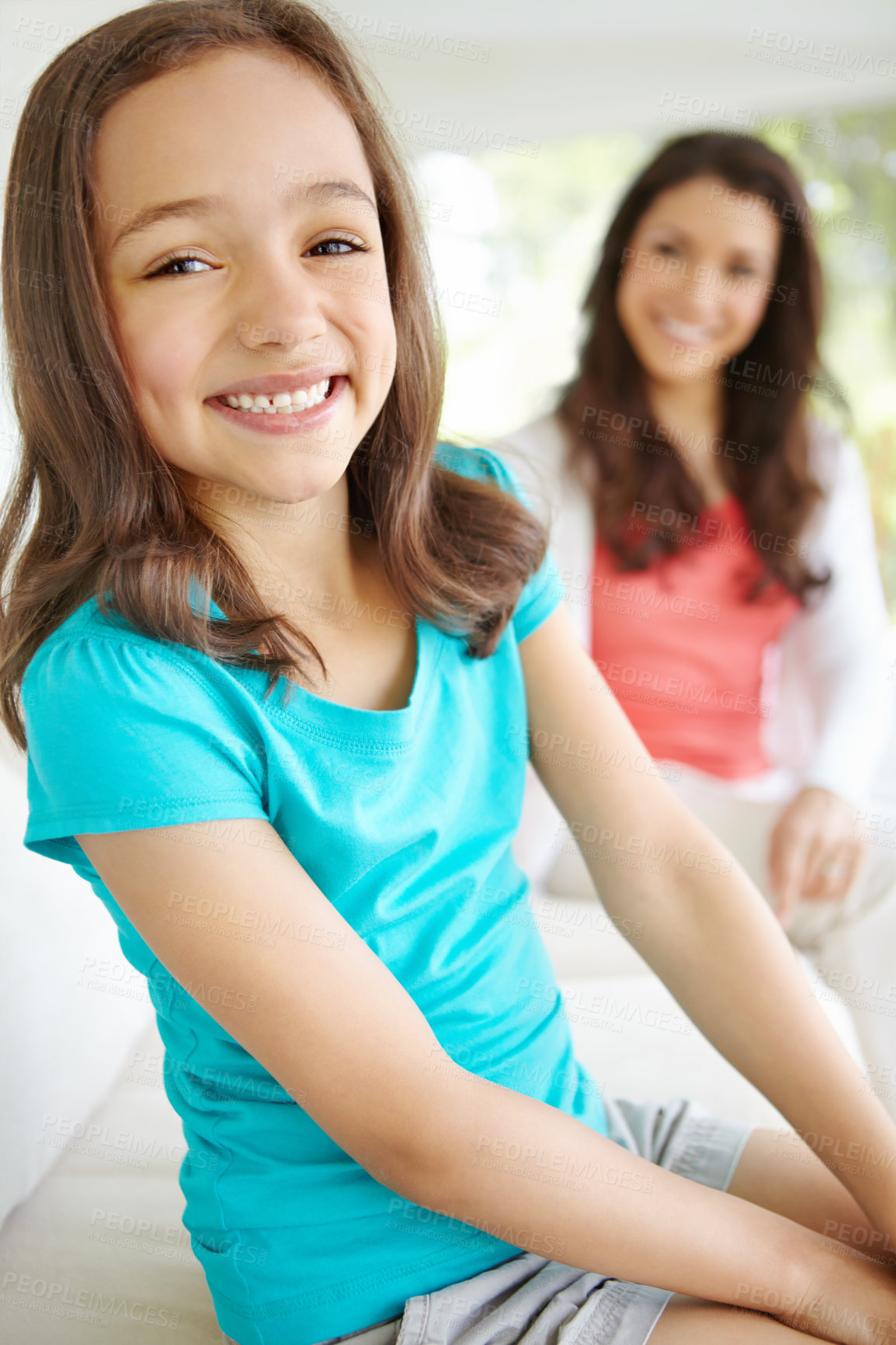 Buy stock photo Portrait, child and smile with mother at house for love, bonding and security of morning care in backyard. Happy, girl and relax on sofa with woman for family support, calm weekend and connection