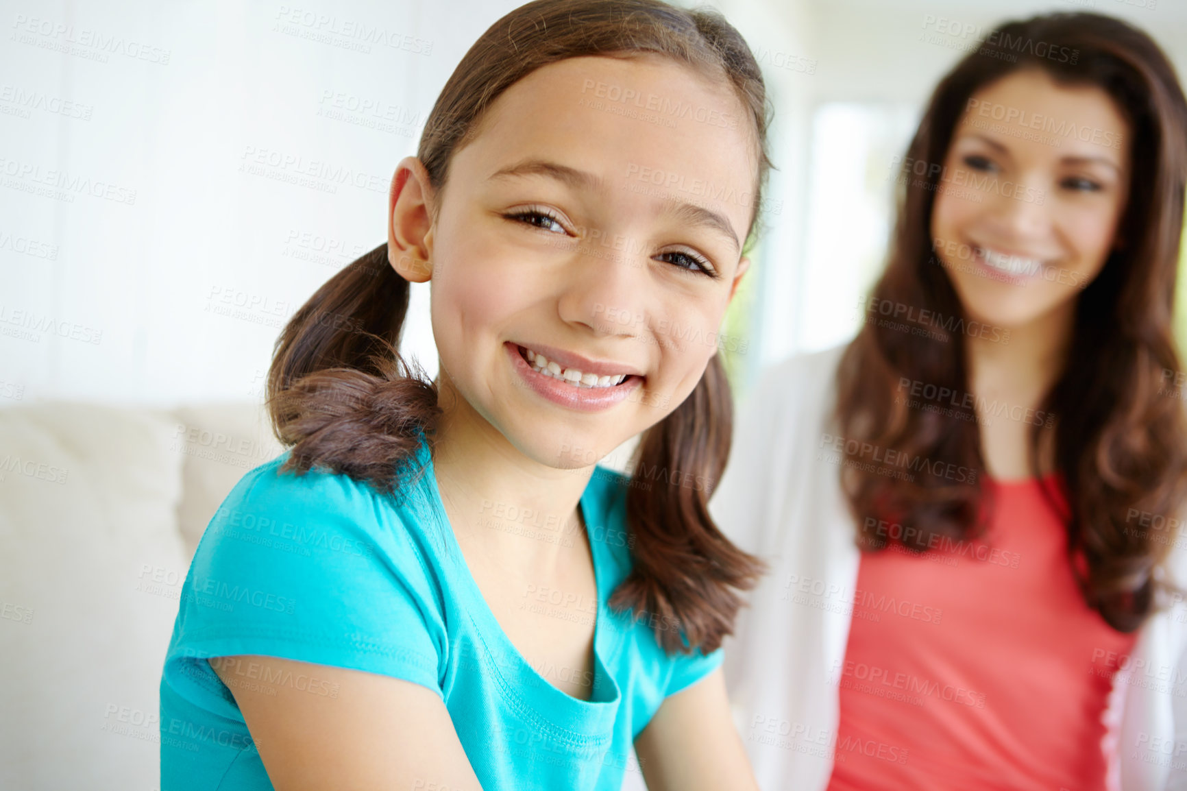 Buy stock photo Portrait, child and relax on sofa at house with mother for bonding, love and security of morning gratitude. Smile, girl and woman on weekend break, care and support together for childhood development