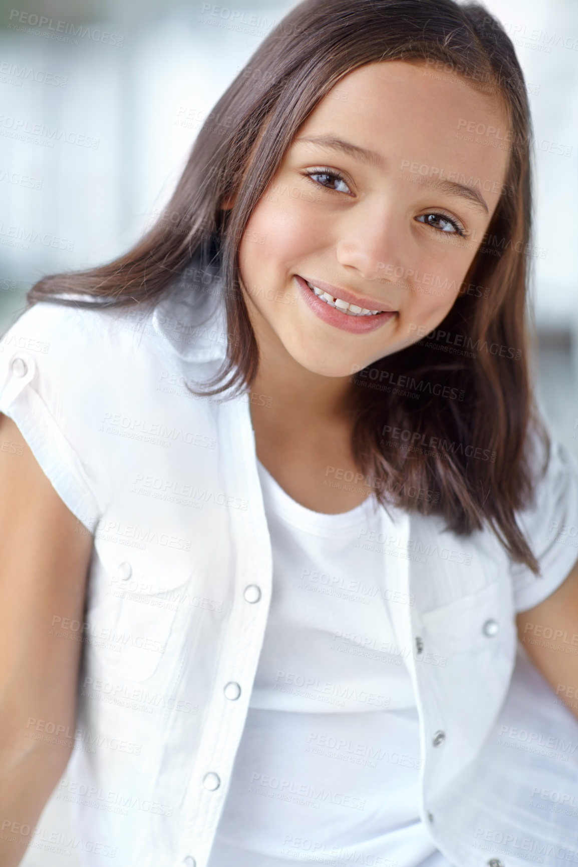 Buy stock photo Happy, confident and portrait of girl in home for joy, growth or fun in living room on weekend to relax. Female child, face and healthy kid alone for school holiday, development or childhood in Spain