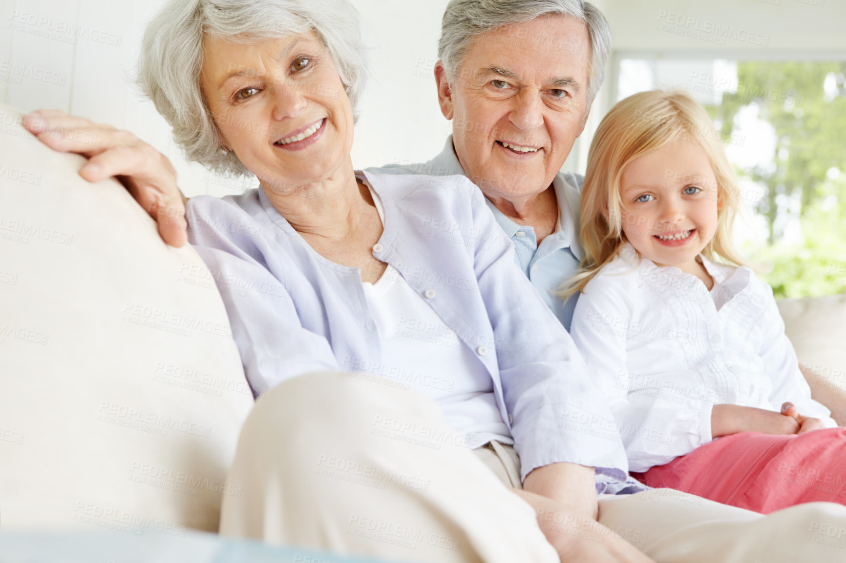 Buy stock photo Senior man, woman and child in portrait with grandparents, happiness and bonding in family home. Elderly people, girl and together for care in living room, house or lounge for growth, support or love