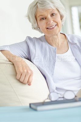 Buy stock photo Senior woman, portrait and relax in home on sofa for retirement, good health and weekend with break. Elderly female, smile and healthy person on pension for positive mood, comfort and peace on couch