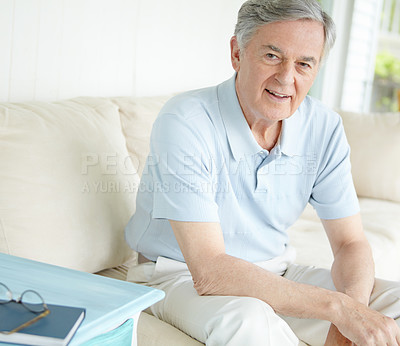 Buy stock photo Elderly man, portrait and relax in apartment on sofa for retirement, good health and weekend with break. Senior male, smile and healthy person on pension for positive mood, comfort and peace in home