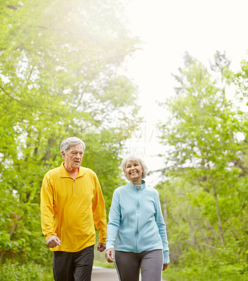 Buy stock photo Senior couple, happy and outdoor for fitness, wellness and walking in nature or bonding together. Elderly people, smile and exercise in retirement for health, workout or training as pensioner in park