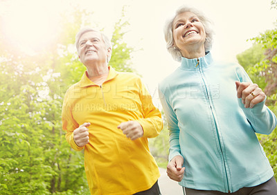 Buy stock photo Elderly couple, smile and outdoor for fitness, wellness and running in nature or bonding together. Senior people, happy and exercise in retirement for health, workout or training as pensioner in park