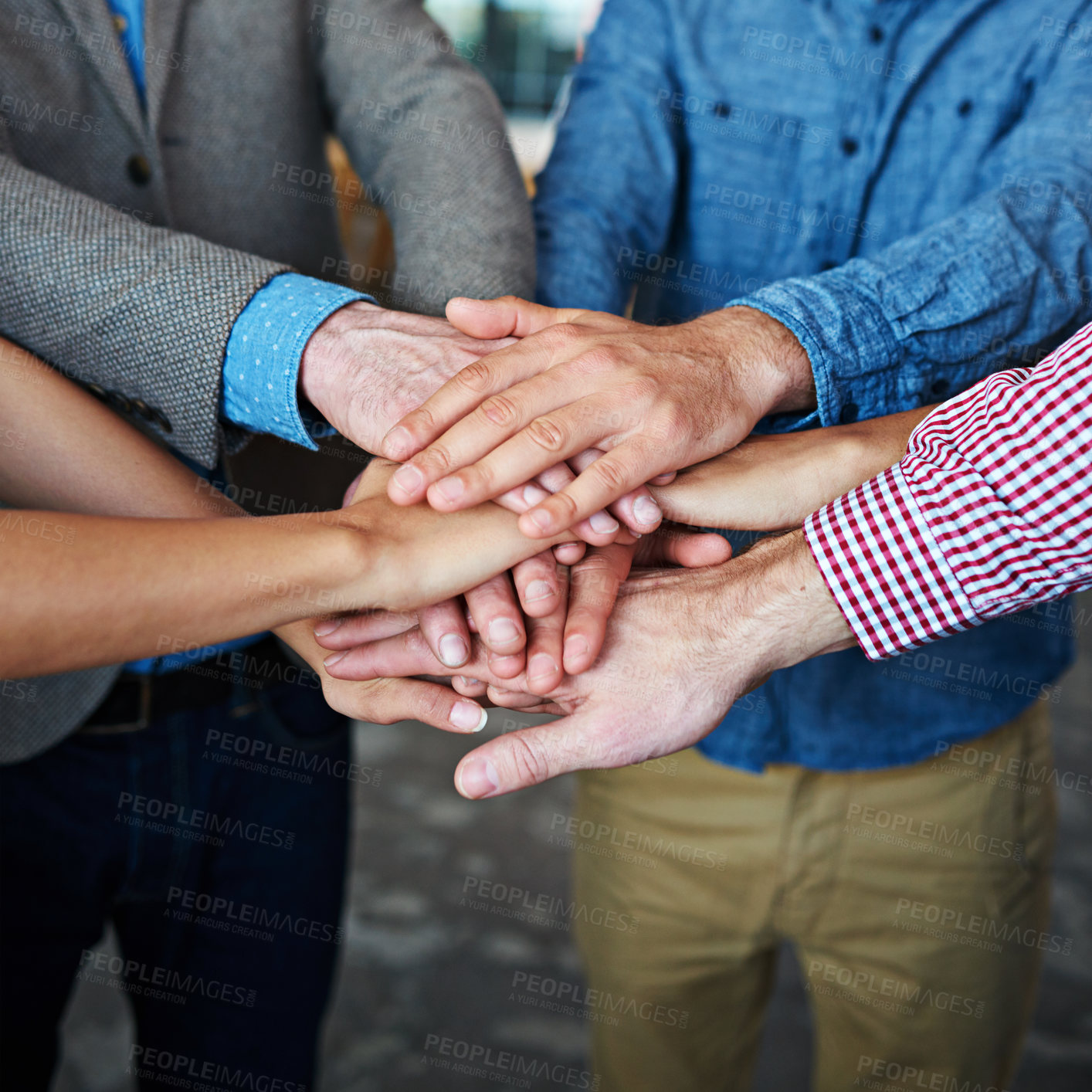 Buy stock photo Teamwork, collaboration and support while putting hands together in an office for motivation and unity amongst colleagues. Group of businesspeople standing together in a huddle during team building