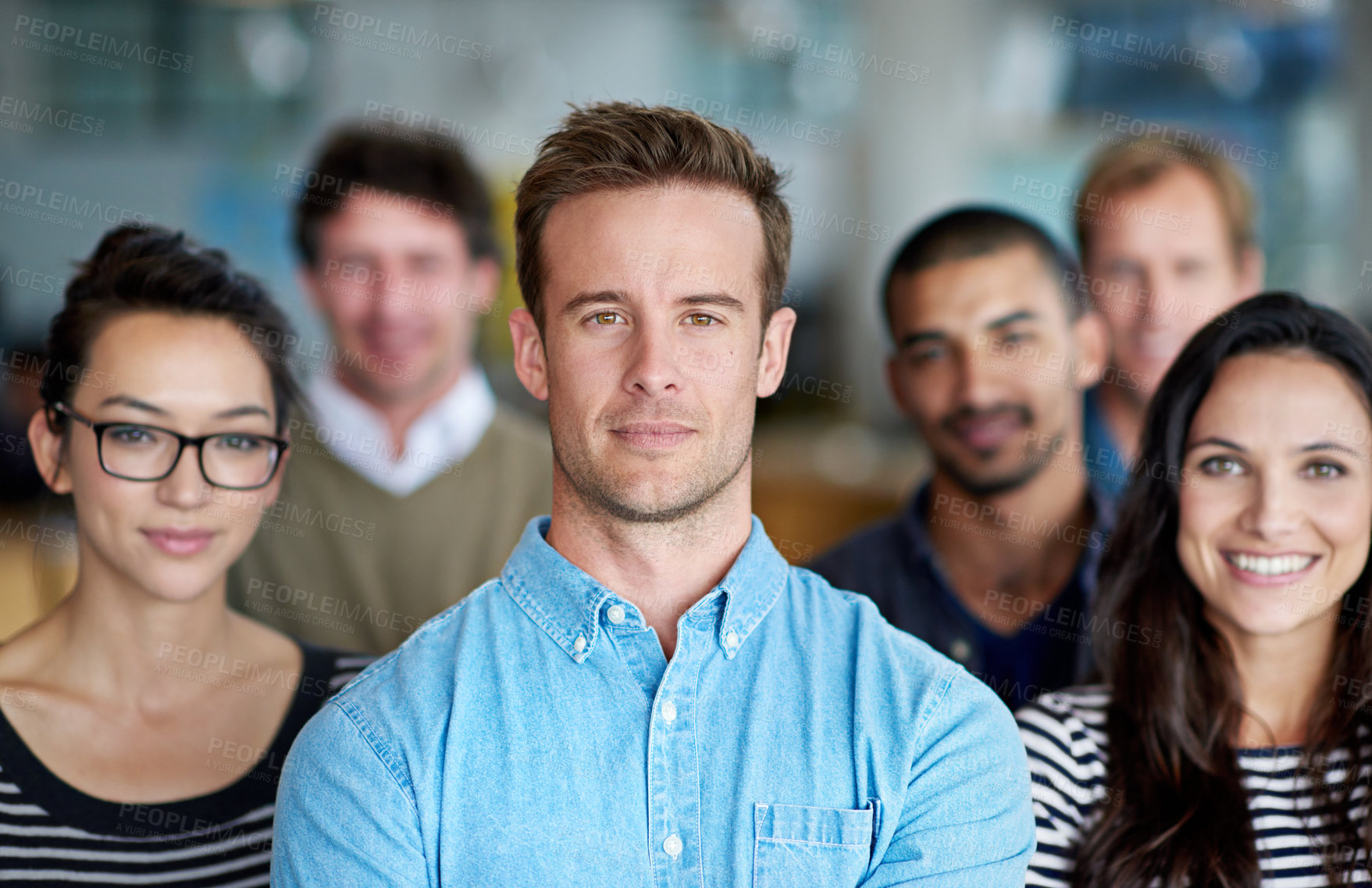 Buy stock photo A group of diverse staff looking determined and proud