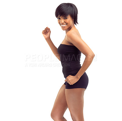 Buy stock photo Studio shot of a fit young african woman posing against a white background