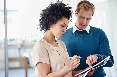Buy stock photo Woman, man and reading with notepad in office with ideas, brainstorming or discussion for creativity. Business people, partnership and notes with mentorship, problem solving and solution at startup