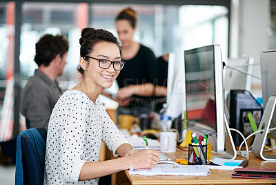 Buy stock photo Portrait of a beautiful young woman working at her desk in an office