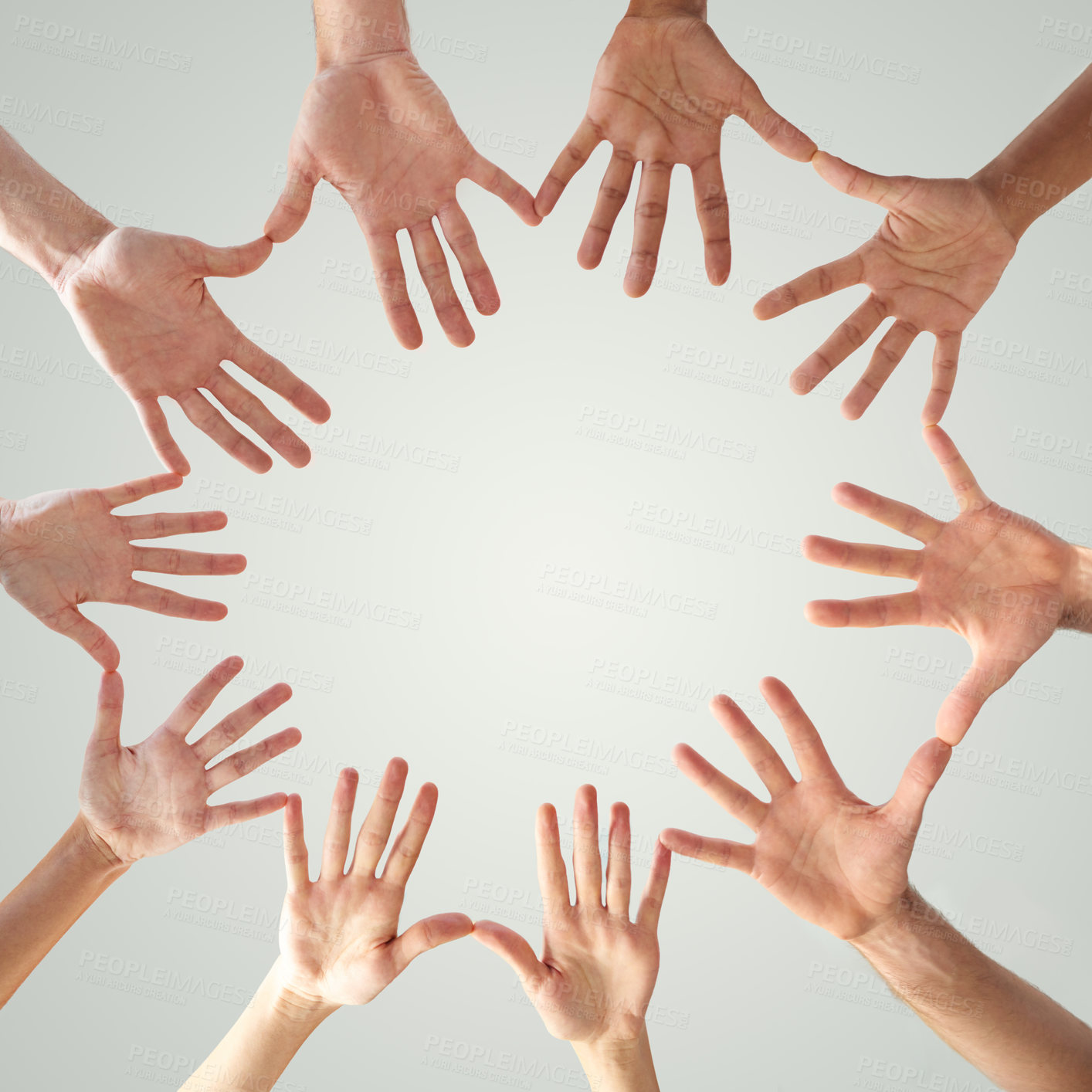 Buy stock photo Motivation, support and hands of people in circle for collaboration, solidarity and community. Low angle, fingers and mockup with round shape on white background for teamwork, connection and trust