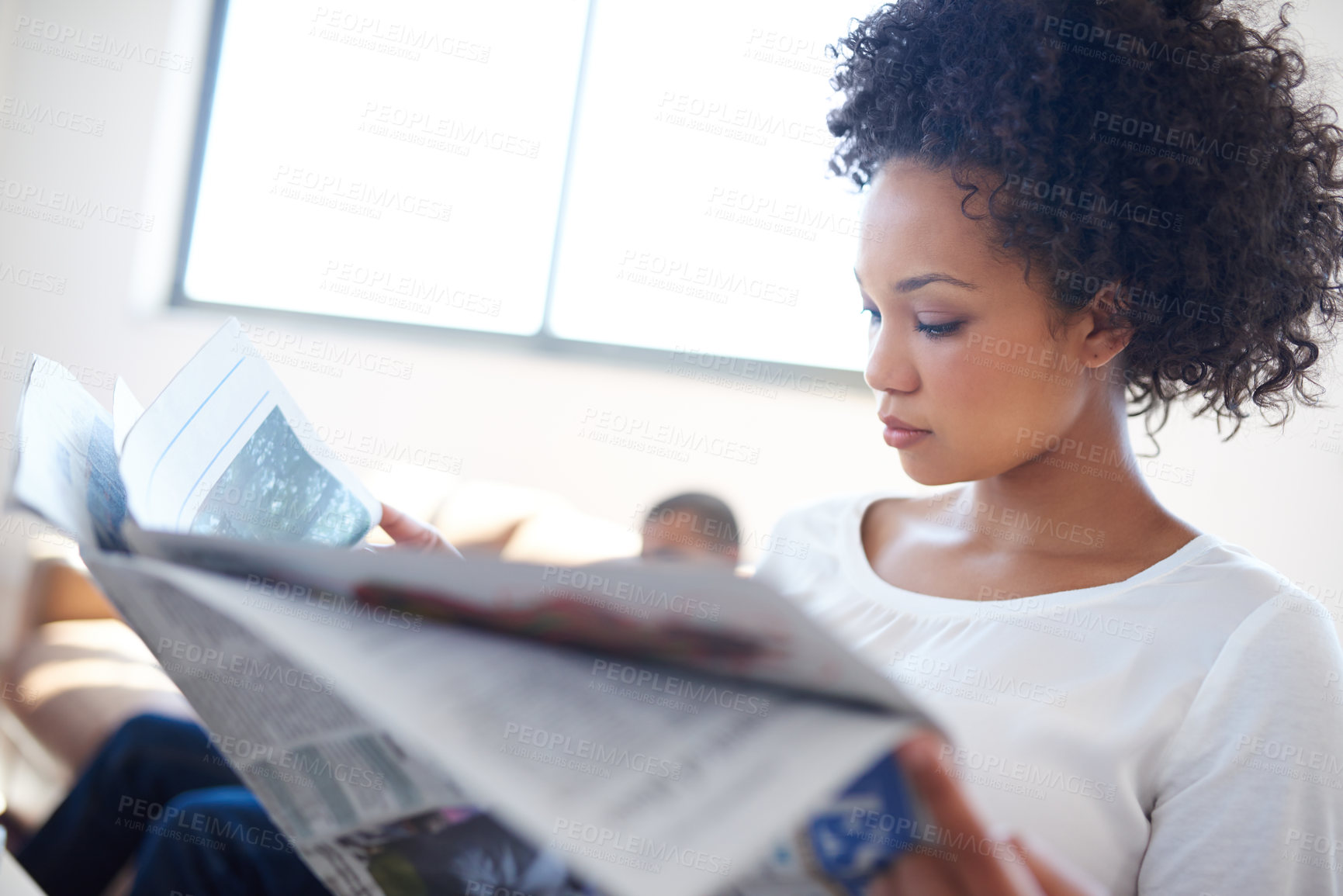 Buy stock photo Woman, reading and newspaper on sofa for knowledge, article or information on politics in living room. Publication, update and female person for global events, newsletter or trending story in home