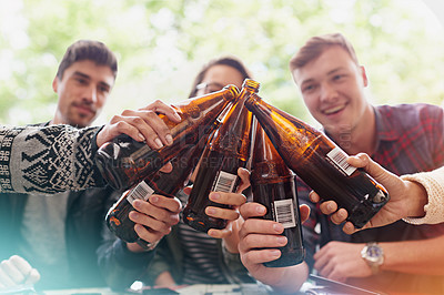 Buy stock photo Outdoor, drinking and friends with beer, toast and cheers with party and restaurant with social gathering. People, dining and group with alcohol and cheers with celebration and reunion with laughing