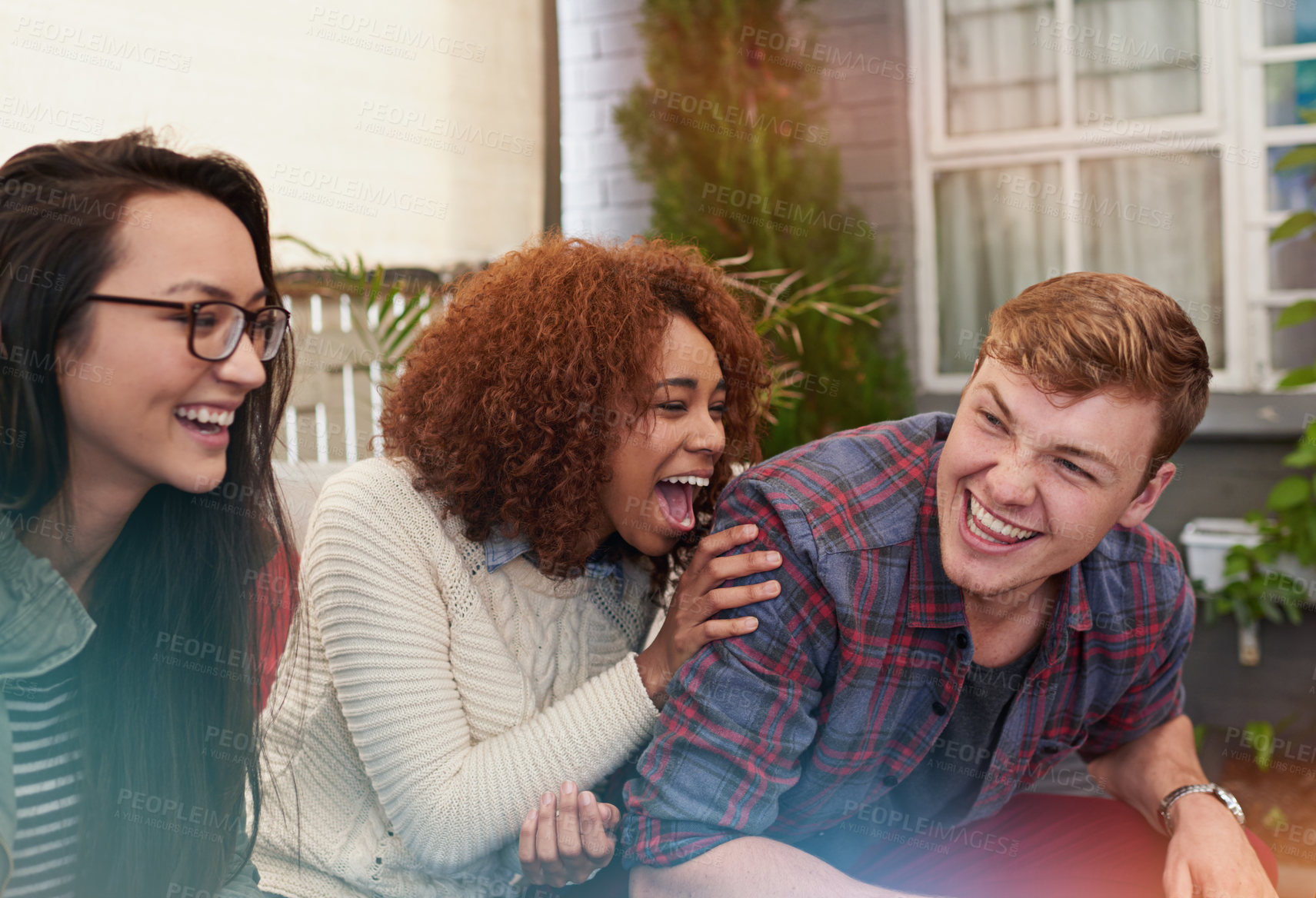 Buy stock photo Friends, comedy and happiness together outdoor, relax at restaurant for bonding and reunion with laughing. Funny story, catch up and social gathering with support, trust and care in friendship group