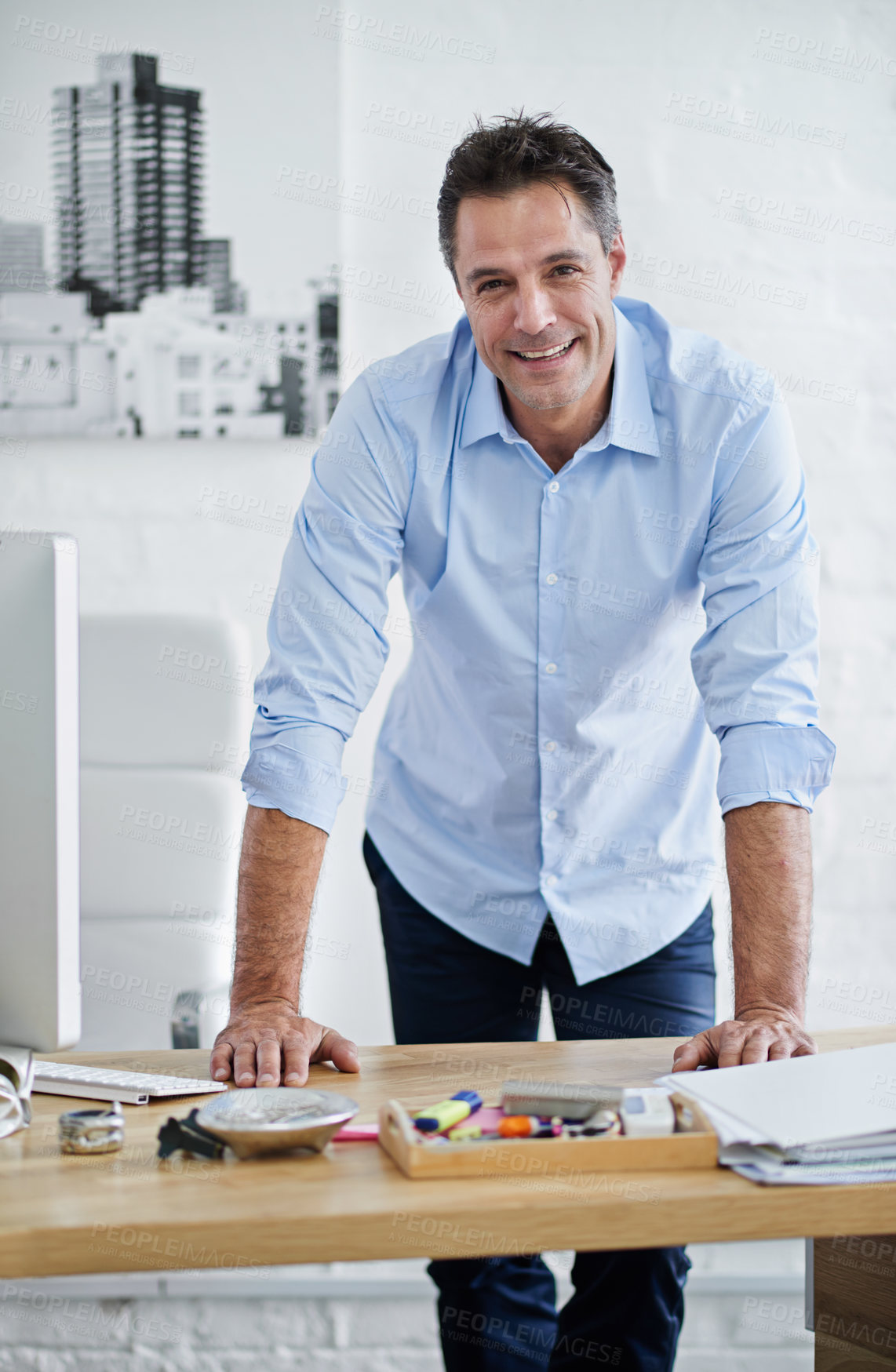 Buy stock photo Businessman, home office and leaning on desk in portrait for career, web designer with computer for job. Male creative, table and happiness for remote work or startup, tech for website development
