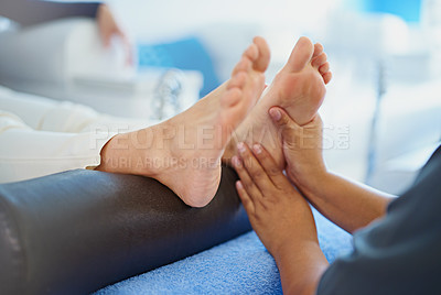 Buy stock photo Cropped shot of a woman having her feet massaged at a beauty spa