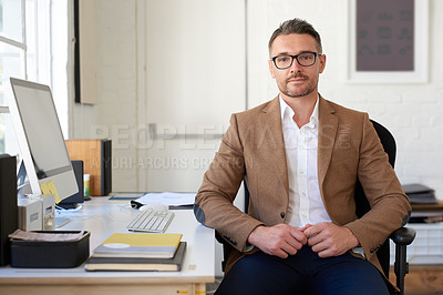 Buy stock photo Portrait of a positive mature creative professional at his desk