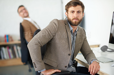 Buy stock photo Businessman, confidence and portrait in office, table and coworking of colleagues, computer and together. Face, working and entrepreneur in company, writer and serious in startup and creative