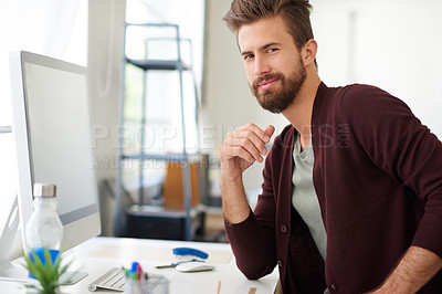 Buy stock photo Portrait of a handsome businessman working in his office