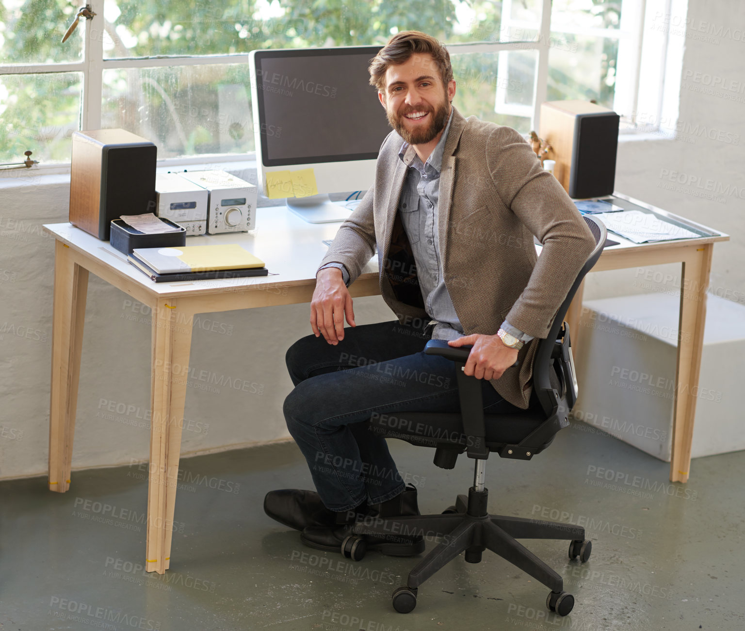 Buy stock photo Portrait of a handsome businessman working in his office