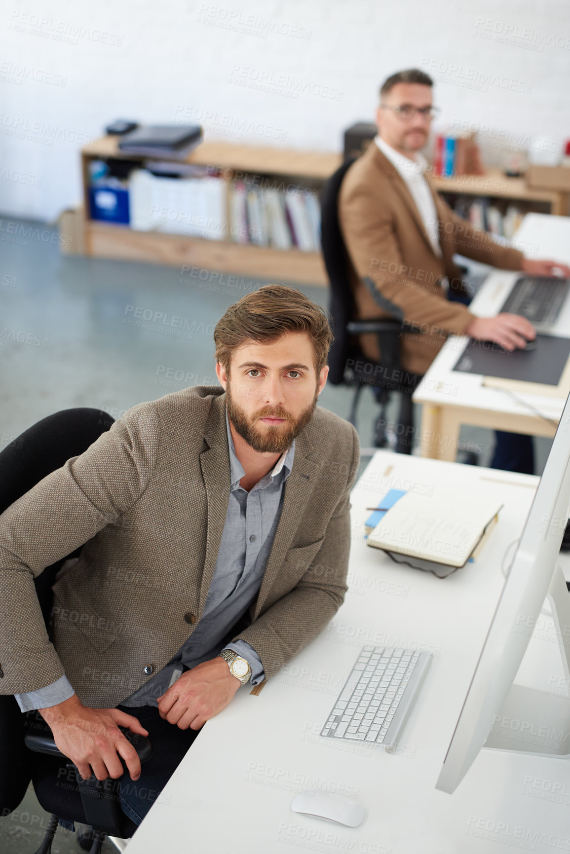 Buy stock photo Businessman, desk and portrait in office, table and coworking of colleagues, computer and together. Above, working and entrepreneur in company, journalist and confidence in startup and creative