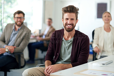 Buy stock photo Smiling creative professional with colleagues in the background
