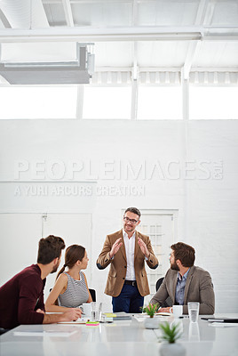 Buy stock photo Shot of a group of businesspeople in the boardroom