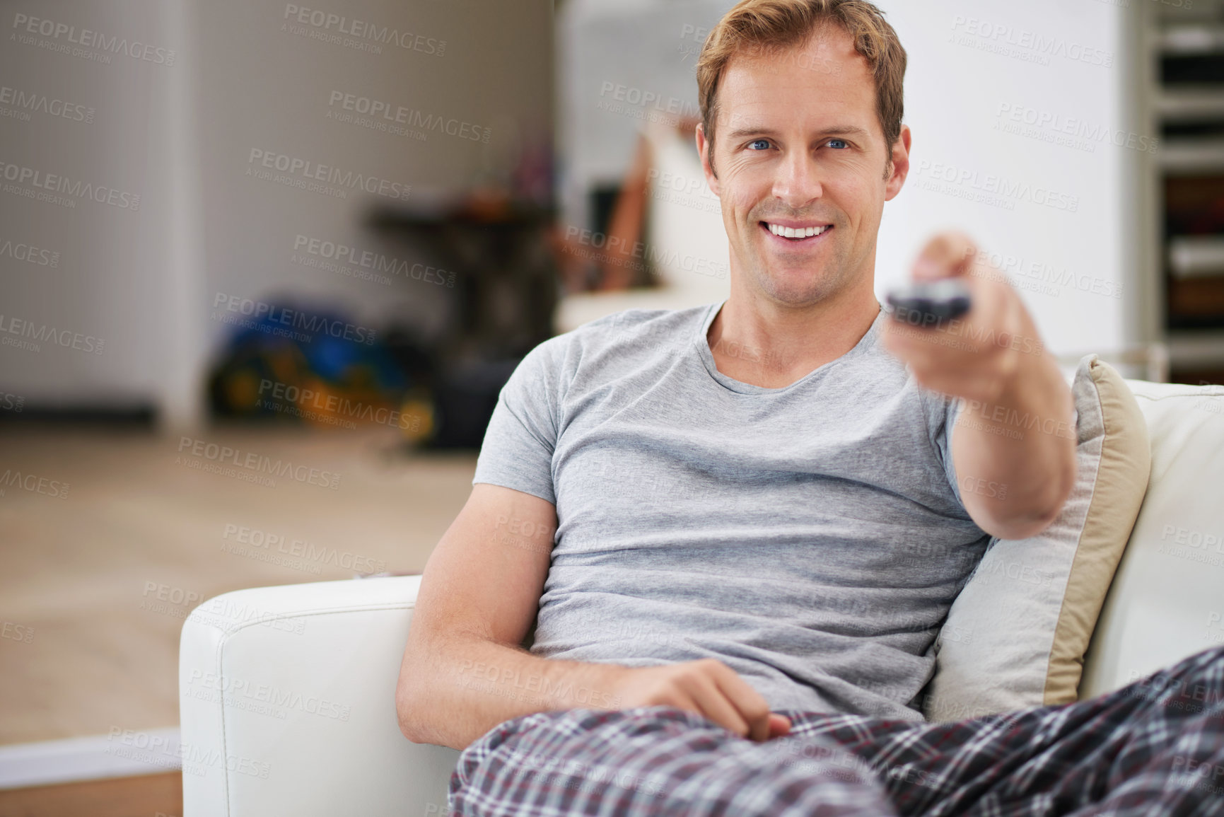 Buy stock photo Relax, smile and man watching tv in home living room on sofa for movie, video or streaming show. Comfort, happy person and television remote control in lounge for film, news or media entertainment