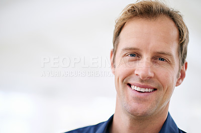 Buy stock photo Cropped portrait of a handsome man looking cheerful