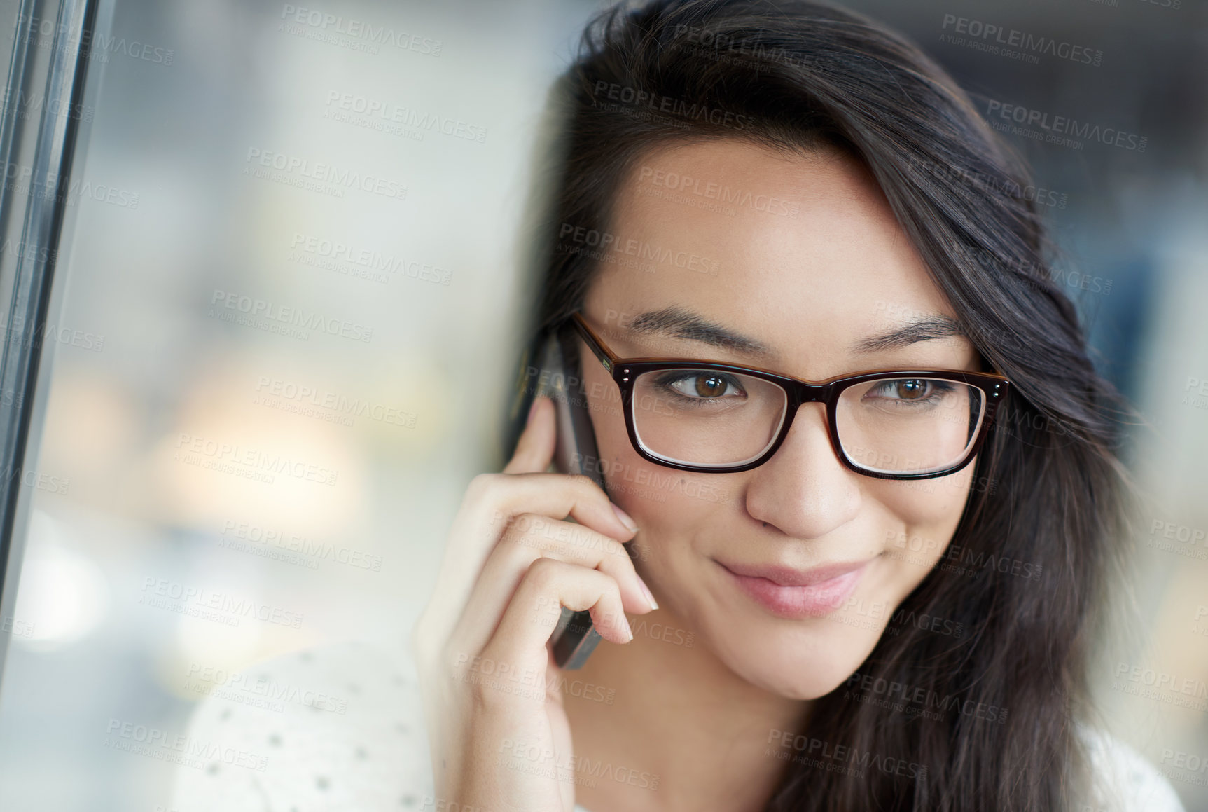 Buy stock photo Smile, phone call and Asian woman by window in office for communication, networking or contact. Happy, technology and female creative designer with cellphone for mobile discussion in workplace.