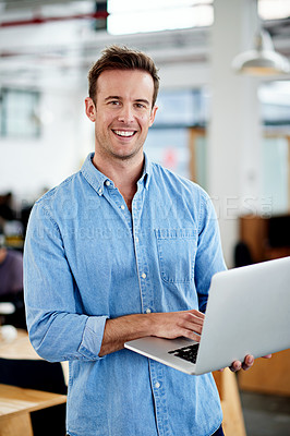 Buy stock photo Businessman, portrait and smile in office with laptop for startup, work and business. Publisher, happy and technology in New York in workplace with research, project and creative design for ebook