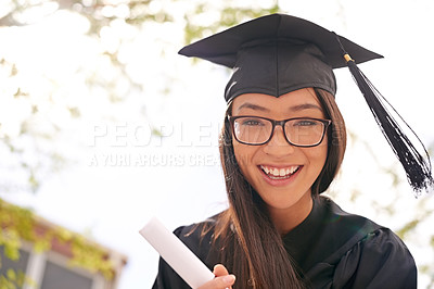 Buy stock photo Cropped shot of a beautiful university student on graduation day
