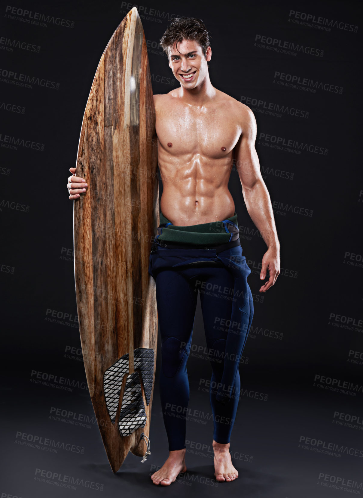 Buy stock photo Studio, surfboard and portrait of male surfer, wetsuit and  athlete isolated on black background. Body, swimsuit and water sports for man model person, equipment and wooden board for fitness or hobby