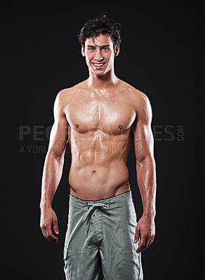 Buy stock photo Man, muscular torso and portrait for fitness, exercise or body building for wellness or muscle growth. Male athlete, shirtless and smile in studio and proud with abs and sixpack on dark background  