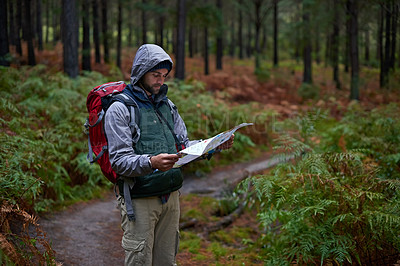 Buy stock photo Hiking, forest and man with map for camping adventure in woods and reading navigation for direction. Backpack, travel and lost in nature trekking with plan to search for location on paper in jungle
