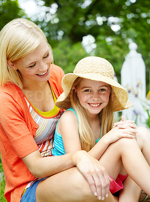 Buy stock photo Smile, mom and child relax in garden for love, care and bonding together. Face, girl and kid with mama outdoor for family connection, relationship and daughter with hat with parent on mothers day