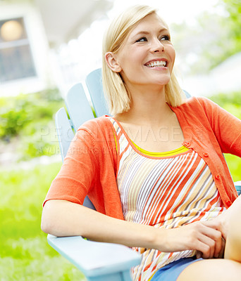 Buy stock photo Cropped view of a pretty woman relaxing in a deckchair outdoors