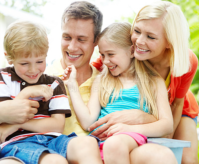 Buy stock photo Happy young family spending time together outdoors