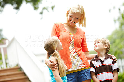 Buy stock photo Bonding, mom and care for children, outdoor and smile in weekend, home and walking with kids and love. Backyard, siblings and happy with mother, boy and girl with woman, house and break for family