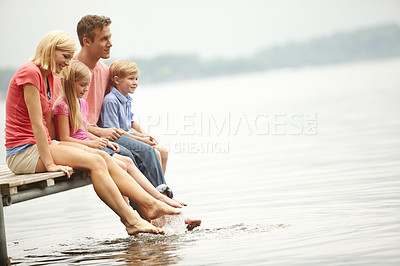 Buy stock photo Water, lake and holiday with family with foot in water for lifestyle with mockup during summer. Kids, child and happy at river for adventure and space for vacation with sunshine for love and travel.