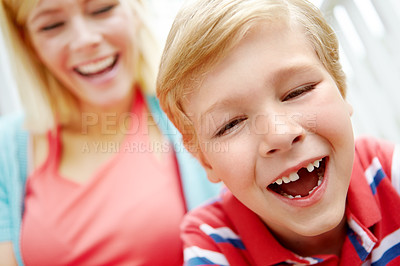 Buy stock photo Love, mother or boy with missing tooth, smile and family in home for humor, growth or funny joke together. Single parent, cavity or mom laughing with happy male kid or dentistry wellness in Australia